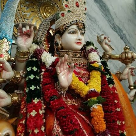 Durga Mata at Hilltop Mandir, adorned with marigold and rose garlands